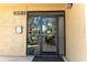 Condo building entrance with glass doors at 3078 Eastland Blvd # 304, Clearwater, FL 33761