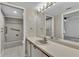Clean bathroom with double vanity and shower/tub combo at 3078 Eastland Blvd # 304, Clearwater, FL 33761