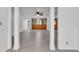Living room with columns, tiled floors, and ceiling fans at 3078 Eastland Blvd # 304, Clearwater, FL 33761