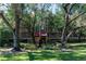 Building exterior with landscaping and trees at 3078 Eastland Blvd # 304, Clearwater, FL 33761