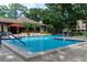 Inviting community swimming pool with lounge chairs at 3078 Eastland Blvd # 304, Clearwater, FL 33761