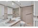 Bathroom with walk-in shower, vanity, and storage at 3078 Eastland Blvd # 304, Clearwater, FL 33761