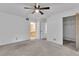 Bright bedroom with ceiling fan and access to bathroom at 3078 Eastland Blvd # 304, Clearwater, FL 33761