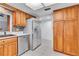 Modern kitchen features stainless steel appliances and ample wood cabinetry at 3078 Eastland Blvd # 304, Clearwater, FL 33761