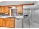 Updated kitchen with wood cabinets and stainless steel appliances at 3078 Eastland Blvd # 304, Clearwater, FL 33761