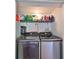 Laundry room with shelving and side-by-side washer and dryer at 3207 Acacia St, Lutz, FL 33558