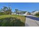Charming ranch home with covered porch and well-maintained lawn at 3207 Acacia St, Lutz, FL 33558