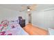 Spacious bedroom with wood floors, ceiling fan and ample closet space at 3207 Acacia St, Lutz, FL 33558