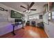 Home office with wood floors, a large desk, and ceiling fan at 3207 Acacia St, Lutz, FL 33558