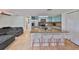 Modern kitchen with granite countertops and breakfast bar at 3207 Acacia St, Lutz, FL 33558