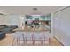 Bright kitchen with granite countertops, stainless steel appliances, and light teal cabinets at 3207 Acacia St, Lutz, FL 33558