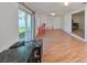 Spacious bonus room with laminate floors, sliding glass doors, and built-in desk at 3207 Acacia St, Lutz, FL 33558
