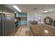 Modern kitchen with stainless steel appliances and granite countertops at 3207 Acacia St, Lutz, FL 33558