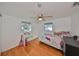 Bright bedroom with wood floors and ceiling fan at 3207 Acacia St, Lutz, FL 33558
