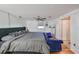 King-size bed, hardwood floors, and a ceiling fan in this large bedroom at 3207 Acacia St, Lutz, FL 33558