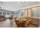 Octagonal dining table with four chairs, built-in hutch with stained glass at 37617 Amigo Dr, Zephyrhills, FL 33541