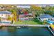 Waterfront property with a private dock and lush green lawn at 52 Sandpiper Rd, Tampa, FL 33609
