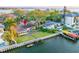 Waterfront property featuring private dock, boat lift, lush landscaping, and a convenient access to bay area at 52 Sandpiper Rd, Tampa, FL 33609