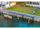 Private boat dock with a seawall offers direct access to the serene waterfront at 52 Sandpiper Rd, Tampa, FL 33609