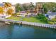 Charming waterfront home features mature palm trees and a private boat dock at 52 Sandpiper Rd, Tampa, FL 33609