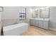 Elegant bathroom with double vanity and a large soaking tub at 6773 Summit View Dr, Brooksville, FL 34601