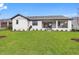 Modern home with large backyard, covered patio and lush landscaping at 6773 Summit View Dr, Brooksville, FL 34601