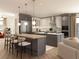 A well-appointed kitchen with a breakfast bar, marble backsplash and stainless steel appliances at 7176 S Shore Dr, South Pasadena, FL 33707