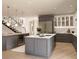 A modern kitchen with a large island, wine cooler and stainless steel appliances under custom lighting at 7176 S Shore Dr, South Pasadena, FL 33707