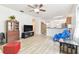 Bright living room with hardwood floors and open layout at 7734 Bristol Park Dr, Apollo Beach, FL 33572