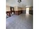 Large living room with tiled floors, currently under renovation at 7906 Gulf Way, Hudson, FL 34667