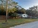 House exterior with wooden fence and grassy yard at 9131 Kosimo St, New Port Richey, FL 34654