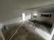 Renovation in progress, kitchen with exposed pipes and flooring at 9131 Kosimo St, New Port Richey, FL 34654