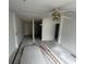 Unfinished living room with ceiling fan and new flooring at 9131 Kosimo St, New Port Richey, FL 34654