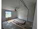Unfinished bedroom with new flooring and a ceiling fan at 9131 Kosimo St, New Port Richey, FL 34654