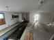 Unfinished kitchen with appliances and new flooring at 9131 Kosimo St, New Port Richey, FL 34654