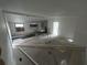Unfinished kitchen with exposed pipes and flooring at 9131 Kosimo St, New Port Richey, FL 34654