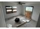 Unfinished bedroom with plywood covering windows at 9131 Kosimo St, New Port Richey, FL 34654