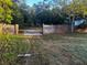 Open backyard area with wooden fence at 9131 Kosimo St, New Port Richey, FL 34654