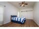 Cozy bedroom with a barn door and blue striped bedding at 10803 Australian Pine Dr, Riverview, FL 33579