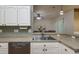 Kitchen with stainless steel sink and dishwasher at 10803 Australian Pine Dr, Riverview, FL 33579