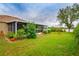 Large backyard with screened patio at 10803 Australian Pine Dr, Riverview, FL 33579