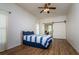 Cozy bedroom with a barn door and blue striped bedding at 10803 Australian Pine Dr, Riverview, FL 33579