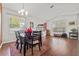 Bright dining room with hardwood floors and a view into the living room at 11701 Colony Lakes Blvd, New Port Richey, FL 34654