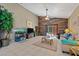 Bright living room with vaulted ceiling, wood accent wall, and sliding glass doors to the patio at 11701 Colony Lakes Blvd, New Port Richey, FL 34654