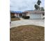 Ranch style home with carport and mature landscaping at 12520 4Th E St, Treasure Island, FL 33706