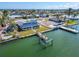 Waterfront home with solar panels and private dock, seen from above at 12520 4Th E St, Treasure Island, FL 33706