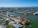 An aerial view of a house on the waterfront with a red pin marking its location at 12520 4Th E St, Treasure Island, FL 33706