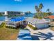 Single Gathering home with a covered roof and a storage container in front at 12520 4Th E St, Treasure Island, FL 33706