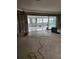 Living room under renovation with exposed framing and flooring at 12520 4Th E St, Treasure Island, FL 33706