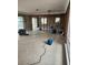 Living room under renovation with exposed framing and flooring at 12520 4Th E St, Treasure Island, FL 33706